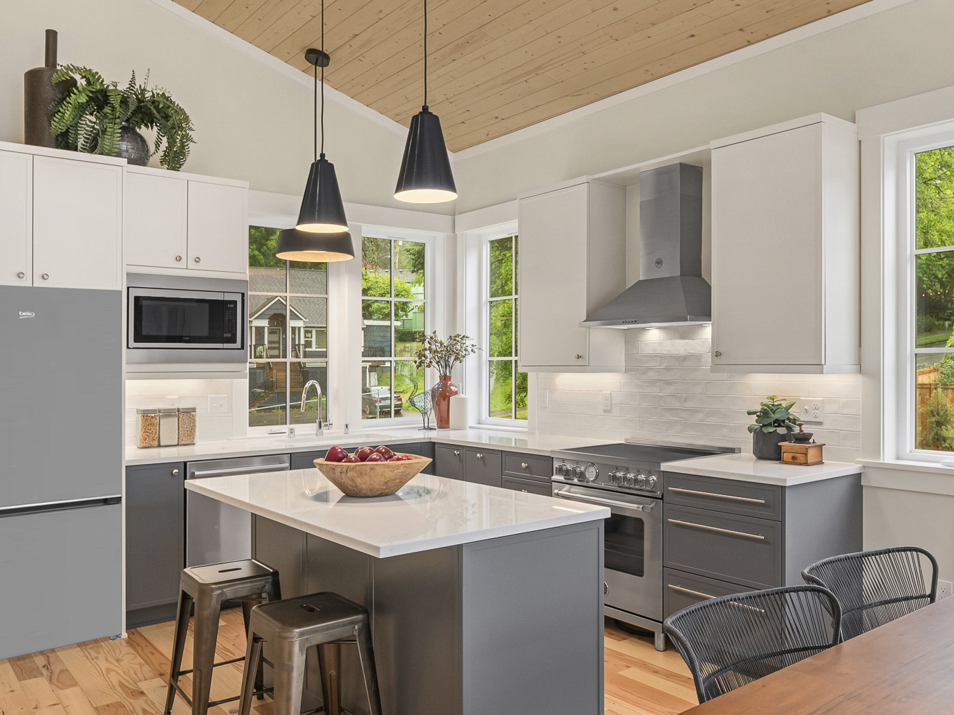 Open-concept kitchen in new construction homes in Seattle with premium finishes and natural light